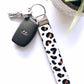 white leopard wristlet